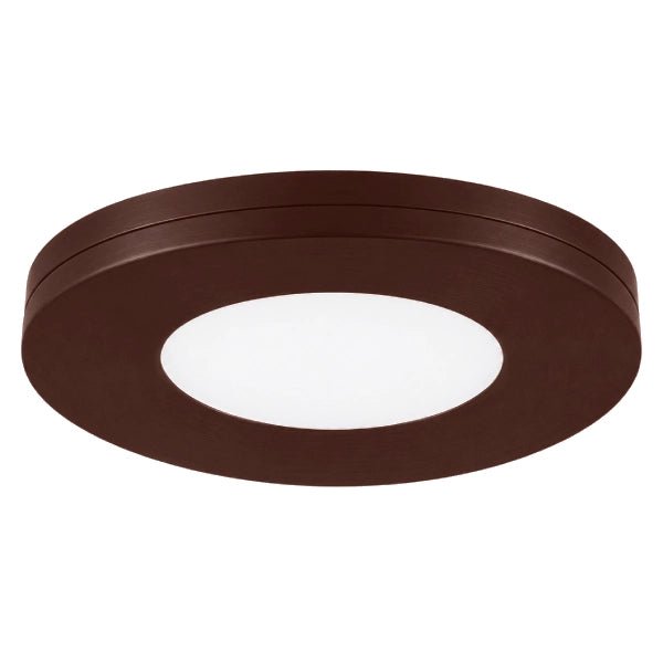 Bronze slim puck under cabinet lighting providing warm and functional illumination